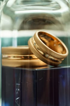 Beautiful wedding rings shot through glass macro