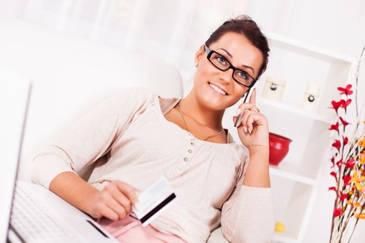 Beautiful young woman Shopping from home.