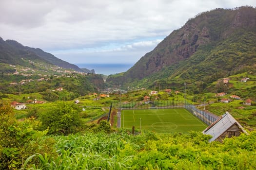 Grass soccer court in Porto da Cruz, Madeira with view to the Atlantic ocean