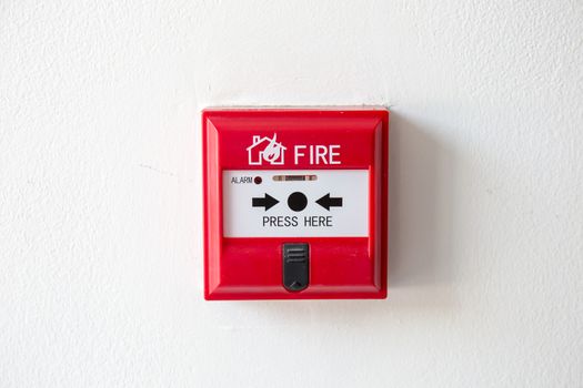 Push button switch fire alarm box on cement wall for warning and security system