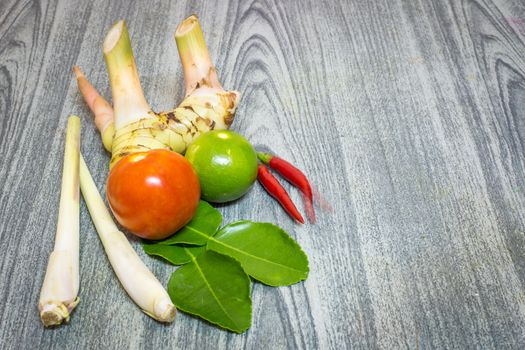 Herb set of Tom Yum Soup Ingredients for Thai food on wood background