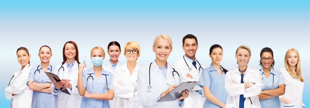 healthcare and medicine concept - smiling female doctors and nurses with stethoscope