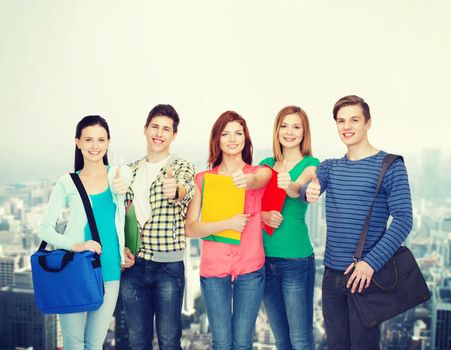 education and people concept - group of smiling students standing