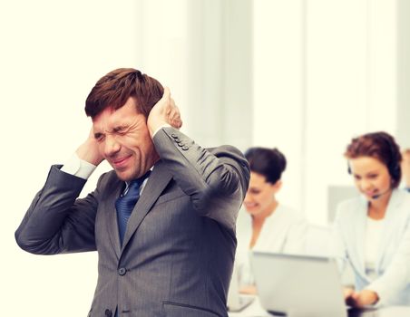 business and office, stress, problem, crisis, loud noise concept - stressed buisnessman or teacher closing ears