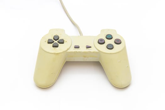 Old white joystick on the white background. video game controller