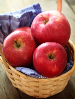 red apples in a basket, shallow dof