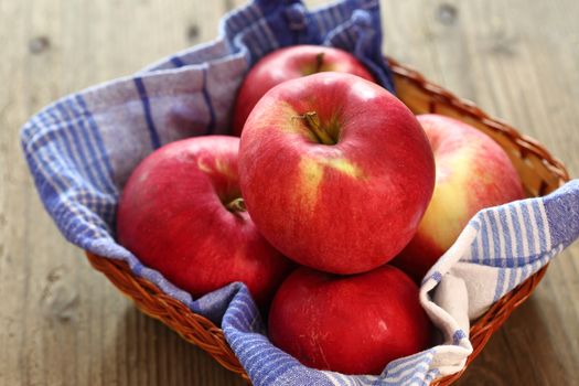 red apples in a basket, shallow dof