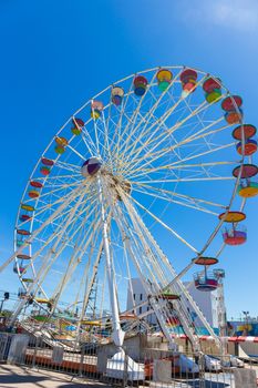 Giant ferris wheel in Amusement park with blue sky background