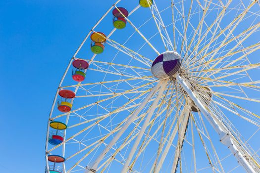 Giant ferris wheel in Amusement park with blue sky background