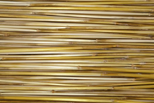 a long dry straw arranged in stripes 