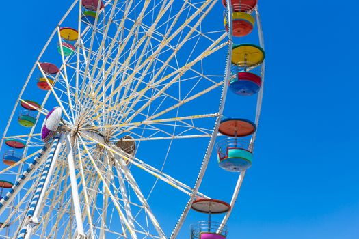 Giant ferris wheel in Amusement park with blue sky background