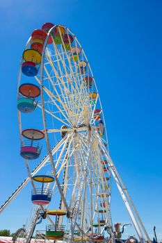 Giant ferris wheel in Amusement park with blue sky background