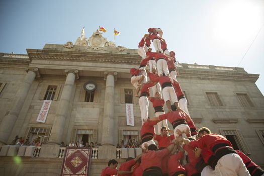 Barcelona, Spain - September 20, 2015: Castelers at La Merce. Human Castle building is a Catalonian tradition and is a UNESCO Masterpiece of the Oral and Intangible Heritage of Humanity