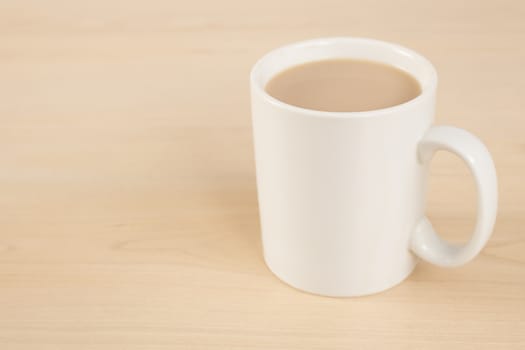 Mug of tea on wooden table