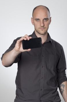 Standing man showing front of phone