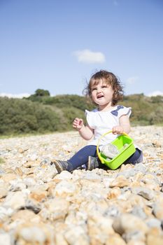 Sitting on a pebble beach