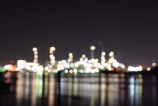 Blurred Light of oil refinery reflecting on the surface