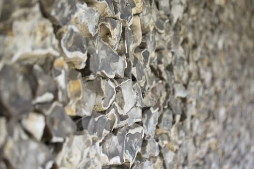 old stone wall made of flint