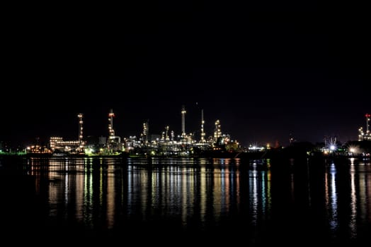 Light of oil refinery reflecting on the surface