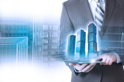 Businessperson holding tablet with 3d city model on cityscape background