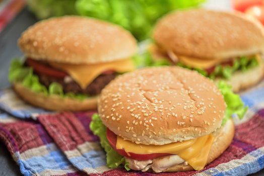 Closeup of home made burgers on wooden table