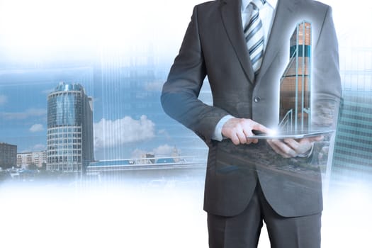 Businessman holding tablet with 3d city model on cityscape background