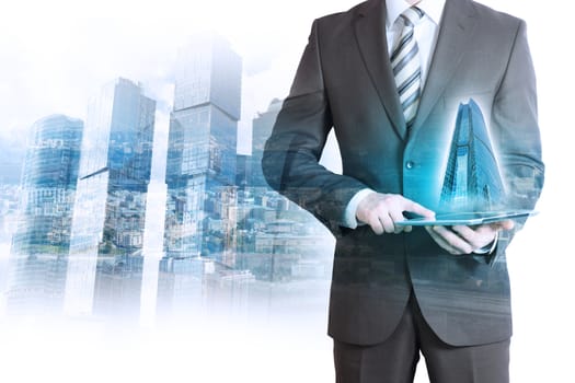 Businessman holding tablet with 3d city model on cityscape background