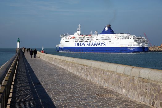 FRANCE, Calais: A ferry boat of the Danish company DFDS leaves the Calais harbour, northern France, on October 26, 2015. DFDS said on June 8, 2015 it had agreed to buy two ferries (Rodin and Berlioz) from rail tunnel operator Eurotunnel which was in partnership with MyFerryLink and had faced antitrust action in Britain over its Dover to Calais service. Eurotunnel said in May 2015 it would not renew contracts expiring on July 2 under which it leased three ferries it had acquired in 2012 from bankrupt maritime transporter SeaFrance to Scop SeaFrance, a cooperative of employee-owners of the re-baptised MyFerryLink line.