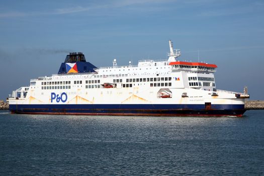 FRANCE, Calais: A ferry boat of the British company Peninsular and Oriental Steam Navigation Company (P&O) arrives at the Calais harbour, northern France, on October 26, 2015. On June 8, 2015, its competitor the Danish company DFDS had agreed to buy two ferries (Rodin and Berlioz) from rail tunnel operator Eurotunnel which was in partnership with MyFerryLink and had faced antitrust action in Britain over its Dover to Calais service. Eurotunnel said in May 2015 it would not renew contracts expiring on July 2 under which it leased three ferries it had acquired in 2012 from bankrupt maritime transporter SeaFrance to Scop SeaFrance, a cooperative of employee-owners of the re-baptised MyFerryLink line.