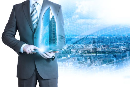 Businessman holding tablet with 3d city model on cityscape background