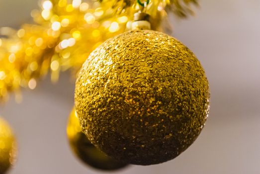 close up of a Golden christmas ball hanging