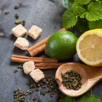 tea composition with cinnamon sticks, lemons