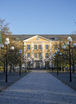City Hall in Umeå, Sweden with a clear blue sky behind it.