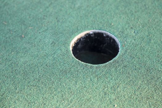 Miniature Golf Course Cup Close up.