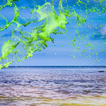 Green water splash on sea background