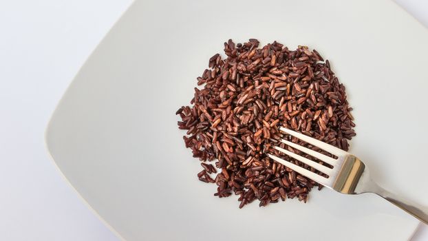 The cooking black rice in dish page have fork