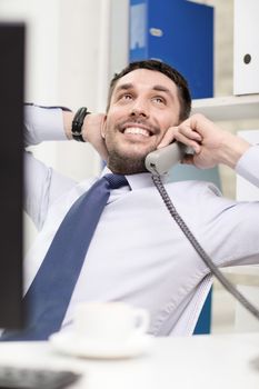 office, business, education, technology and internet concept - smiling businessman or student with computer and phone