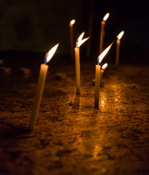 the dying candles in the church of the Holy Sepulchre in Jerusalem