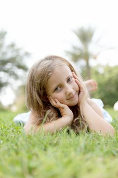 pretty blond girl outdoors in summer day