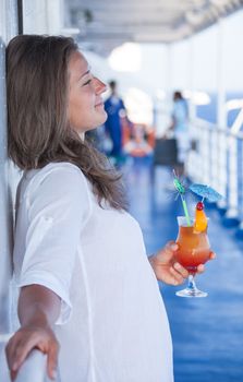 Girl enjoys traveling sipping a cold cocktail