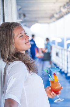 Girl enjoys traveling sipping a cold cocktail
