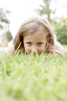 cute blonde baby girl on nature