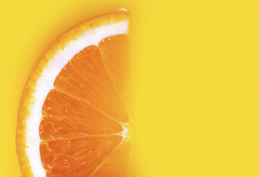 fresh a slice of orange on yellow background