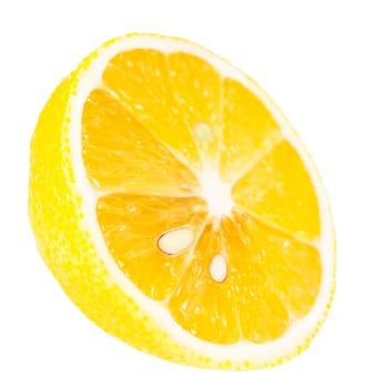 juicy ripe slice of lemon on the white isolated background