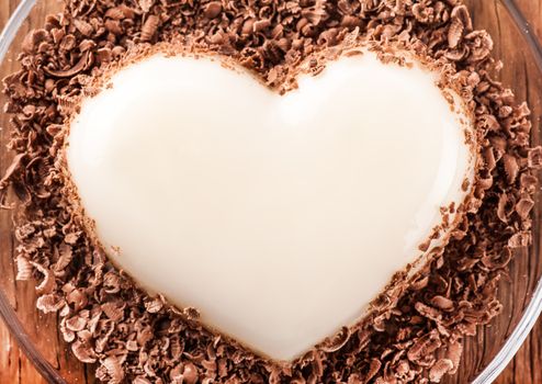 vanilla jelly in the form of heart close-up on wooden background