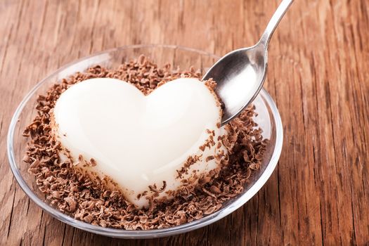 vanilla jelly crumb chocolate with a spoon on a wooden background