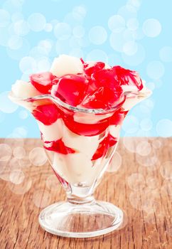 cubes of white and red jelly in glass goblet