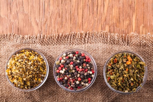 dry spices in a glass bowl on a vintage background