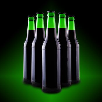 beer in glass bottles on a dark background