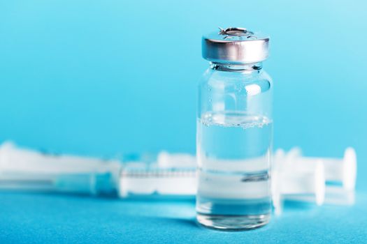 bottle of medicines close-up on a blue background